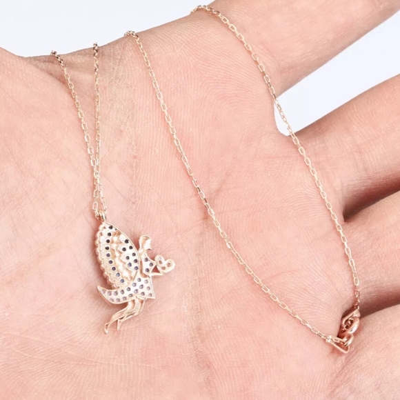 Blue winged fairy holding a white Topaz heart - Picture 3 of 4